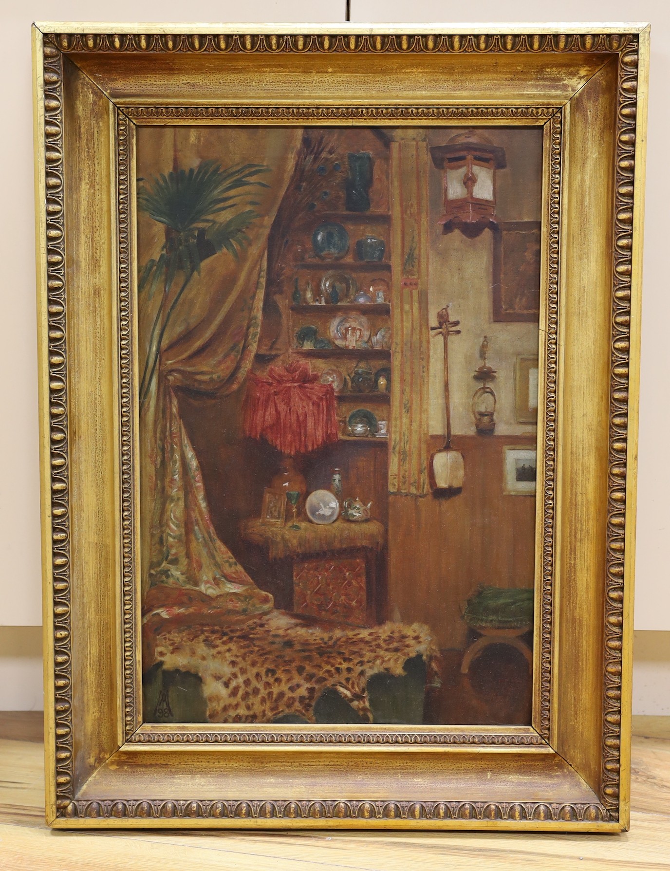 A.M. 98, oil on canvas, Orientalist interior with leopard skin rug, monogrammed and dated '98, 59 x 39cm